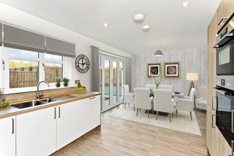 3 bedroom showhome | open plan kitchen and dining area with French doors to rear garden