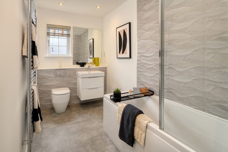 3 bedroom showhome | stylish family bathroom with sleek fittings and shower/bath with full-height tiling