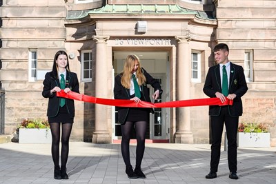 Pupils return to former school for grand entranceway opening at landmark restoration
