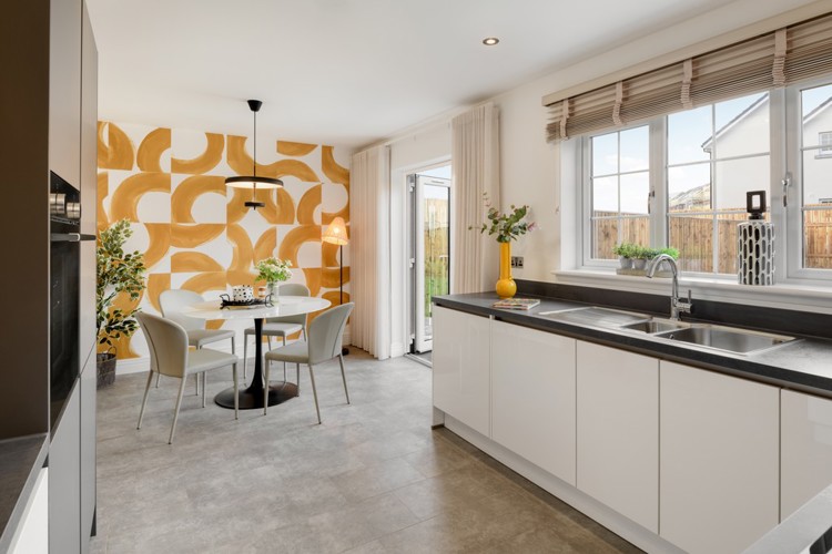 3 bedroom showhome | open plan kitchen and dining area with French doors to rear garden