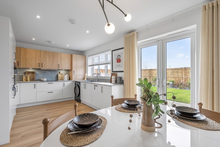 3 bedroom showhome | open plan kitchen and dining area with French doors to rear garden